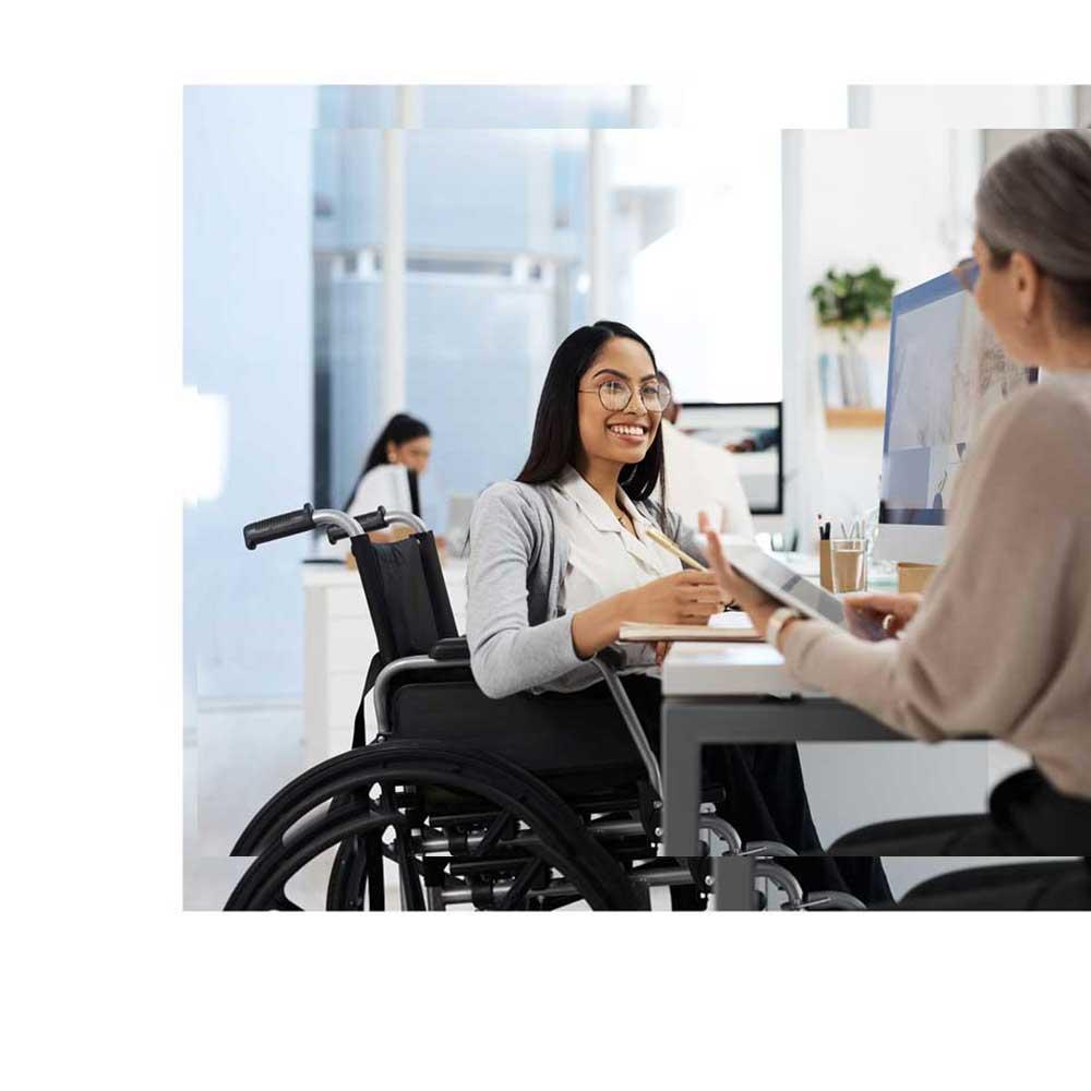 Young woman in wheelchair discussing CentralSquare community development software.